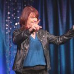 Jodi Silverman speaking in front of a crowd
